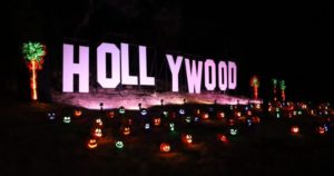 replica of hollywood sign lit up by small jack o lanterns