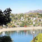 Looking west over the Silver Lake resevoir from Baxter Street with iconic Griffith Park Observatory and the Hollywood Sign in the distance.