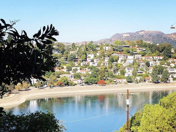 Looking west over the Silver Lake resevoir from Baxter Street with iconic Griffith Park Observatory and the Hollywood Sign in the distance.
