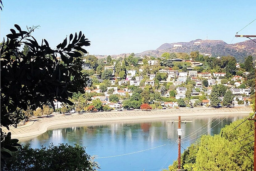 Looking west over the Silver Lake resevoir from Baxter Street with iconic Griffith Park Observatory and the Hollywood Sign in the distance.